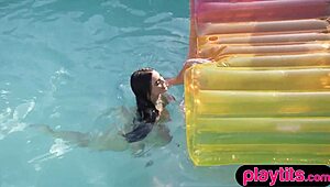 Busty milf strips in the pool, showing wobbly boobs