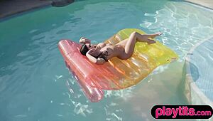 Busty milf strips in the pool, showing wobbly boobs