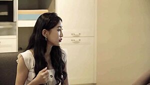 Female hospitality secretary shines in soft Korean setting.