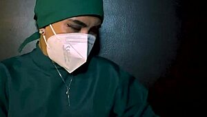 The latex-gloved femdom mistress dominates her submissive in a fetish session