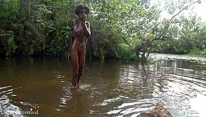 Girl from the village has a bath in the river