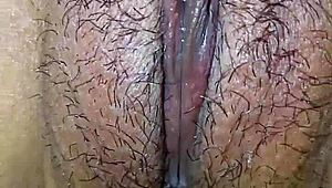 Slut paints clitoris close-up