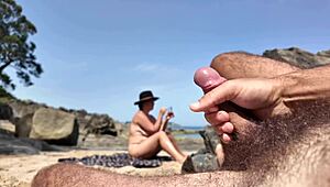 Milf Crushes Stranger’s Dick on Beach While He Jerks Off Nearby
