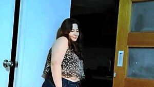 A cute fat girl is having fun in her bedroom