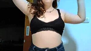 A cute fat girl is having fun in her bedroom
