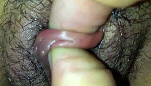 Slut paints clitoris close-up