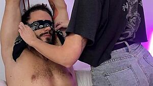 Blindfolded submissive boytoy endures teasing foot tickles