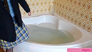 sophia smith splashes in the bathtub with her clothes on for fun