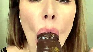 Paige in fishnets takes big black cock dildo, finishes with mouth