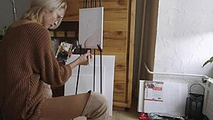 blonde babe paints a flower on her pussy while showing off ass, boots, and tits 😍