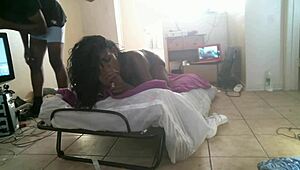 In the hood, a thick ebony milf strips naked on the street.