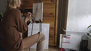 blonde babe paints a flower on her pussy while showing off ass, boots, and tits 😍