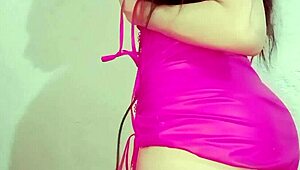 Young Latina Dances In Pink Dress