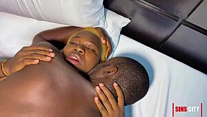 This horny Nigerian couple is masturbating together, with big tits and asses on display