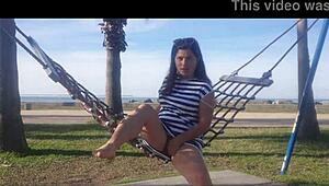 Naked girl bent over on the public beach today.