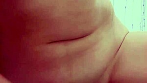 latina gives handjob in bathroom with dildo