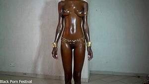 Perfect shiny black body with oily tits on display
