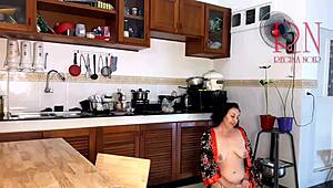 This housewife teases in pantyhose while cooking in kitchen.