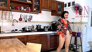 This housewife teases in pantyhose while cooking in kitchen.