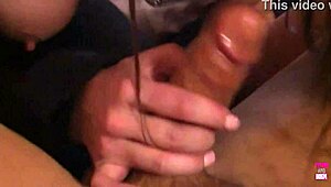 A sexy babe with big fake tits enjoys cowgirl riding and deepthroat in a group scene on the bed