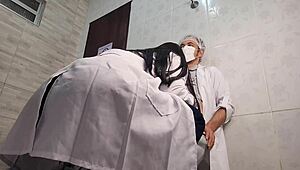 Naughty nurse examines doctor intimately in hospital bathroom setting