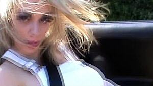 Babestation babe Chessie Kay teases outdoors in the countryside.