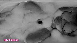 Kity Hudson plays with toy in steamy bath session