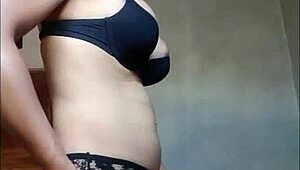 hey, see this shemale cum hard in black bra?