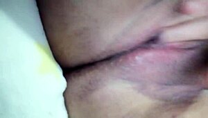 She masturbates quietly, squirting while family is nearby.