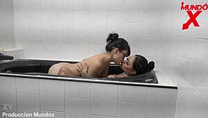 Friends relax in bathtub awaiting groom