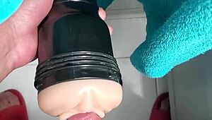 After a cold shower, black cock pounds a fleshlight with intense moans