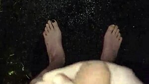 I'm masturbating in the rain, naked with my big cock out