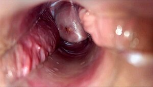 horny woman uses speculum for pulsating orgasm inside vagina.