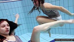 shaved brunette with big tits bathes in pool and shower underwater