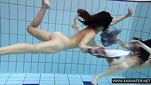 shaved brunette with big tits bathes in pool and shower underwater