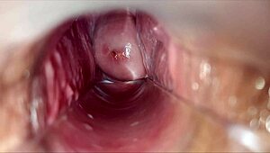 horny woman uses speculum for pulsating orgasm inside vagina.