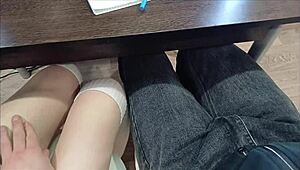 Bold handjob grips classmate's cock during intense lecture