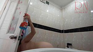 The naked maid cleans toilet and shower without panties