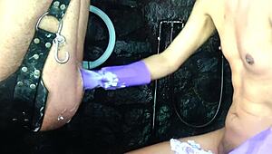 In this amateur video, a shemale undergoes relentless BDSM fisting with a big hand, loving every moment.