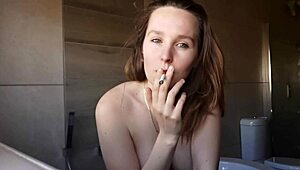 Look at the horny brunette smoking