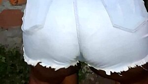 Neighbor with large buttocks cleans the backyard