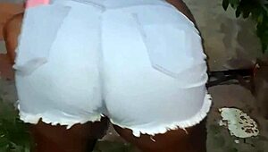 Neighbor with large buttocks cleans the backyard