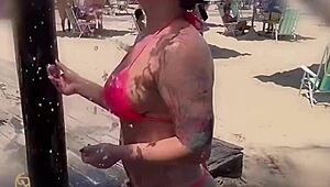 Blonde sucks monster black cock on beach