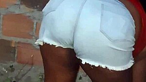 Neighbor with large buttocks cleans the backyard