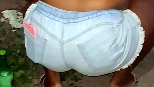 Neighbor with large buttocks cleans the backyard