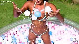 putri cinta in a paddling pool film, looking so relaxed