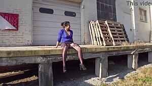 Milf shows off her curvy ass in stockings and skirt at the loading docks