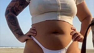 Redhead Flashes Swollen Pussy Lips on Beach