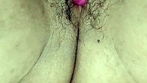 Mature woman at home plays with her dildo