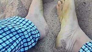 Intense barefeet modeling teases sandy nature with footfetish sensations.